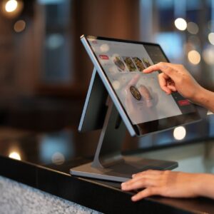 A Close-Up Shot of a Cashier Using a Point of Sale System